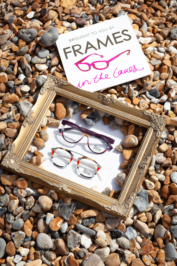 Glasses in a frame with pebbles
